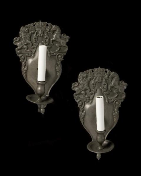 Pewter finished pair of one light sconces with crest back plates